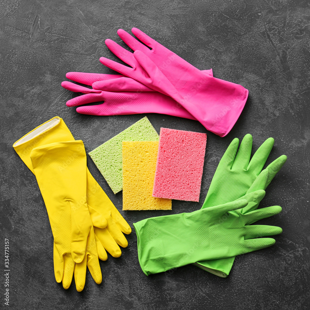 Set of cleaning supplies on dark background