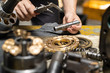 © Kanemme6 - Professional mechanic man holding Valve rod of the hydraulic piston pump to inspection and repair maintenance heavy machinery