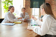 © master1305 - Friendly. Young caucasian women working in office. Meeting, tasks giving, talking. Women, managers in front-office working. Concept of finance, business, girl power, inclusion, diversity feminism
