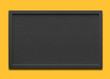 Empty black message board on the yellow background 