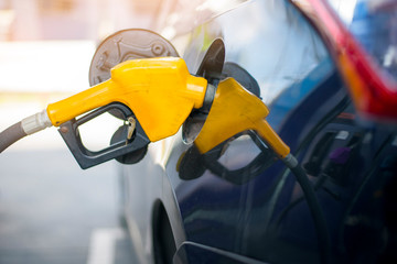 Close up of car is refilling oil fuel in Gas Station