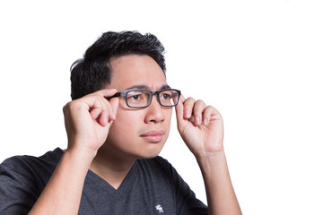 man holding eyes glasses looking forward can not see clear doubt face asian man ethnic isolated on white background