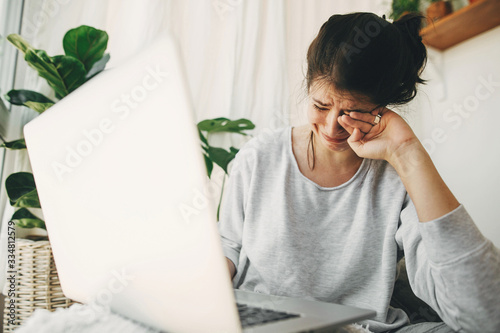 Photographie Young woman worries about losing job, depression