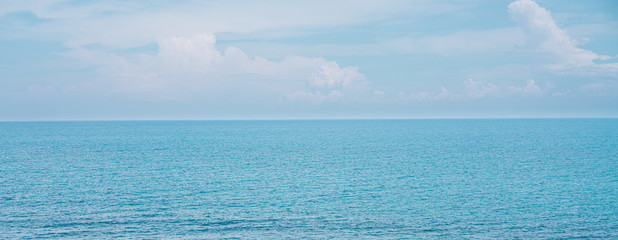 Soft blue waveless Indian ocean extending all the way to horizon