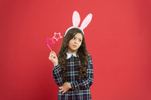 Celebrate Traditional Feast. Easter Bunny Costume. Funny Little Girl In Rabbit Ears. Happy Childhood. Sad Kid Hold Party Glasses. Spring Holiday Tradition. Schoolgirl Have Fun