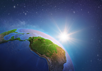 Wall Mural - sun shining over amazonia from space