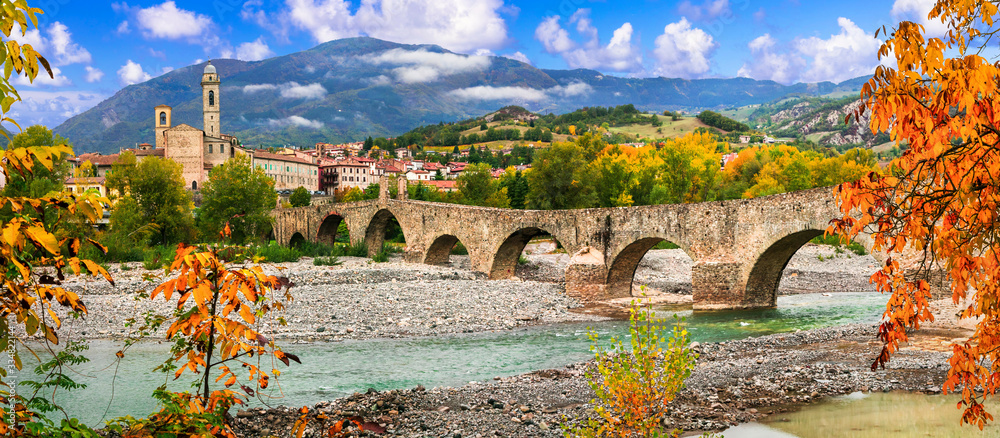 landmarks of Italy . Bobbio - beautiful ancient town with impressive roman bridge, Emilia Romagna - obrazy, fototapety, plakaty 