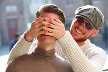 Two Boys Portraying See No Evil Hear No Evil By Covering Over Each Others Eyes And By Stopping Op Their Ears