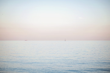 Transparent sea water and a beautiful blue sky. The sea scenery.