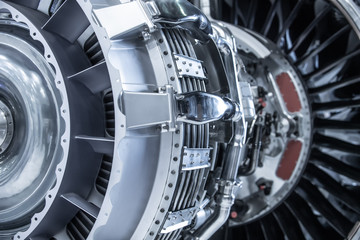 Turbine Engine. Aviation Technologies. Aircraft jet engine detail during maintenance. Blue toned.