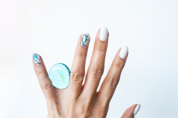 watercolor manicure design. Woman's hand with original nail design on white background. Space for text