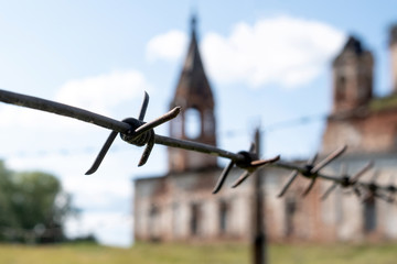 barbed wire on the background of an old building