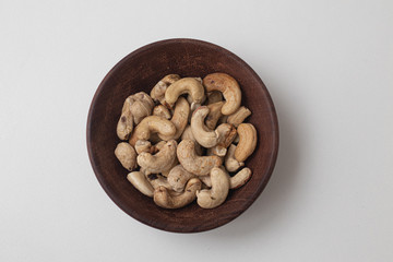 Wall Mural - Cashew Nuts in a wooden bowl