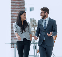 Sticker - employees of the company discuss working issues standing in the office