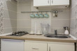 © hiv360 - small kitchen interior of flat apartments or hostel