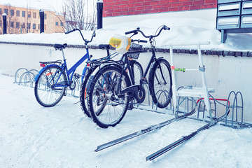 Wall Mural - Bicycles parked in snowy street winter Rovaniemi