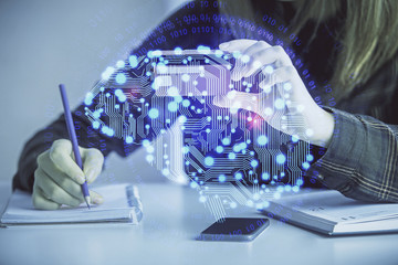 Double exposure of woman on-line shopping holding a credit card and brain hologram drawing. Data E-commerce concept.