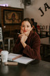 © Kelly - young woman in cafe
