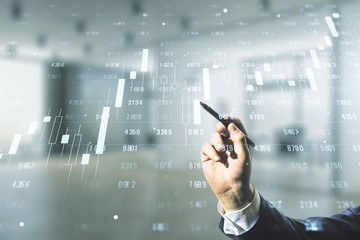 Poster - Multi exposure of businessman hand with pen working with creative statistics data hologram on blurred office background, stats and analytics concept