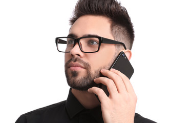 Poster - Young businessman talking on smartphone against white background