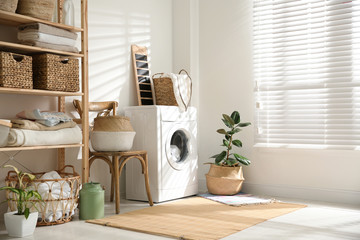 Poster - Modern washing machine and plants in laundry room interior