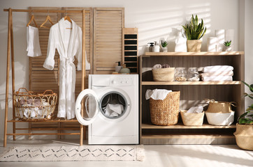 Poster - modern washing machine and shelving unit in laundry room interior