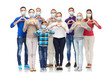 © Syda Productions - health, quarantine and pandemic concept - group of people wearing protective medical masks for protection from virus showing hand heart gesture