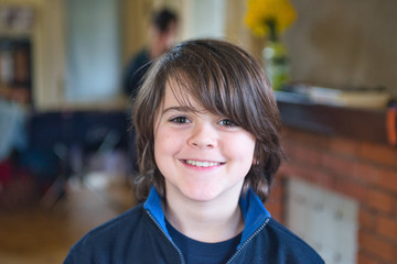 portrait of smiling child in own home