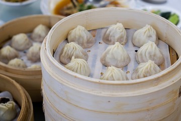 steamed Xiaolongbao meal set serve in bamboo bucket dish at Chinese restaurant