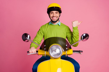 Poster - Portrait of his he nice attractive confident cheerful cheery guy riding moped showing advert ad new novelty like follow subscribe solution isolated over pink pastel color background