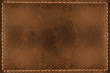 Cognac leather background with seams