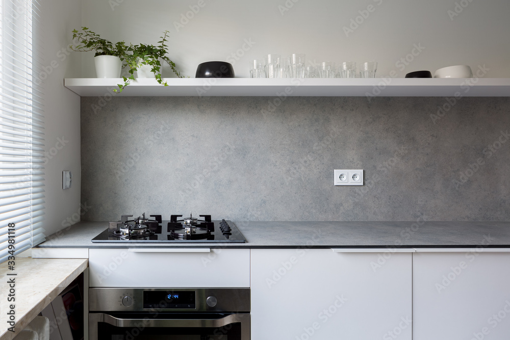 Stylish kitchen with gray countertop - obrazy, fototapety, plakaty 