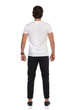 © studioloco - Man In Mocassins, Black Trousers And White T-Shirt Is Standing Relaxed. Rear View.