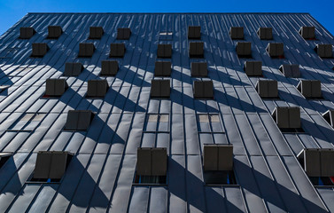 Open windows and shadows on this modern facade