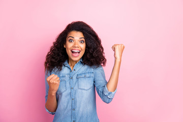 Sticker - Portrait of amazed crazy afro american girl win hear wonderful lottery win news scream wow omg feel rejoice emotions raise fists wear casual style outfit isolated over pink color background