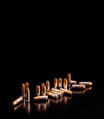 Bullet isolated on black background with reflexion. Rifle bullets close-up on black back. Cartridges for rifle and carbine on a black.