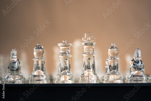 Fotomural Chess board game made of glass, business competitive concept