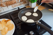 © sergiophoto - Baking pancakes in modern kitchen. Steps of making cooking pancake at home. Stay home, isolation concept