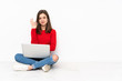 © luismolinero - Tenaager girl working with pc isolated on white background showing ok sign with fingers