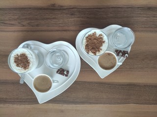 Wall Mural - heart shaped cookies on wooden table and cup of coffee