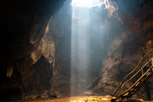 Bat Cave On Lombok With Beautiful Sun Rays Coming In From The Top. 