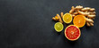 © Jane Vershinin - Top view on healthy ingredients for boosting immunity - ginger, turmeric, and citruses on the black backboard