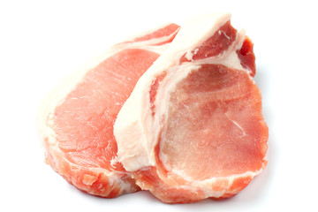 Raw pork meat steak closeup on a white background, top view, flat lay. isolate.