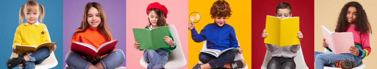 Happy pupils reading colorful books