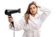 © Ljupco Smokovski - Young woman in a bathrobe blowdrying her hair