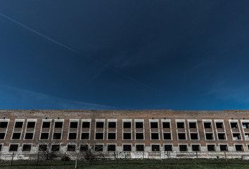 A multi-storey ruined building and sky.