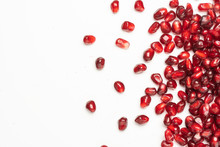 Pomegranate Seeds On A White Background