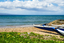 Hawaiian Outrigger Canoes On A Beach In Maui, Hawaii