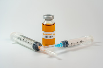 Wall Mural - Coronavirus vaccine bottle and medical syringe injection