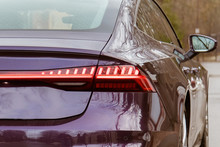 Premium LED Sedan Taillights. The Car Is Purple In The Street. Close-up